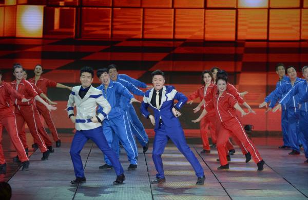 《小蘋果》、《最炫民族風》等廣場舞曲將會有全國統(tǒng)一、編排科學、帶給人正能量的全新動作。 CFP 資料